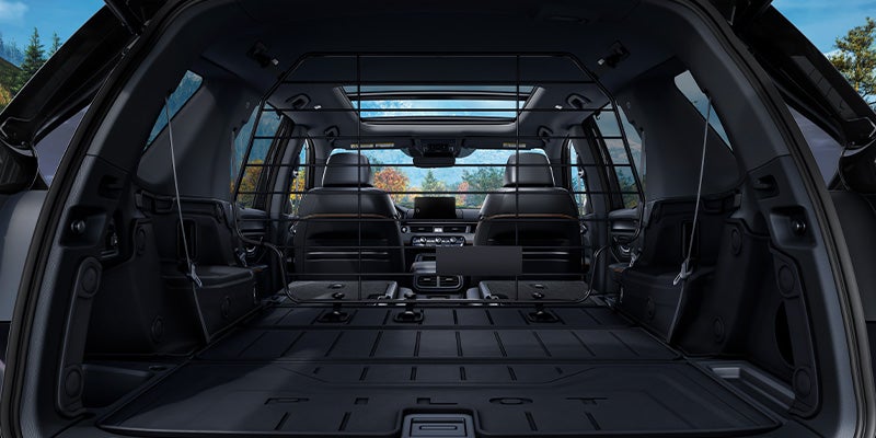 Cargo area of SUV with rear seats folded flat, showing interior space from the back.