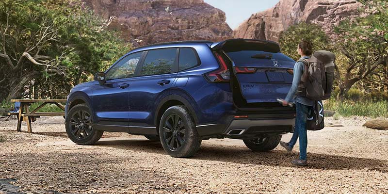 2026 Honda CR-V with hands-free tailgate opening in a rugged outdoor setting.